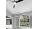 Bright bedroom showcasing arched window and shutter combination, and pool view at 4473 Diamond S Cir, Sarasota, FL 34233