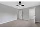 Spacious bedroom boasting a ceiling fan, neutral walls and plush carpeting at 4473 Diamond S Cir, Sarasota, FL 34233