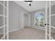 Bedroom features a vaulted ceiling, a closet, and a large window with shutters at 4473 Diamond S Cir, Sarasota, FL 34233
