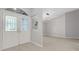 Bright foyer with wood floors, chandelier, and double doors to the exterior at 4473 Diamond S Cir, Sarasota, FL 34233