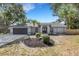 Charming single-story home featuring a well-manicured front yard and attached two-car garage at 4473 Diamond S Cir, Sarasota, FL 34233