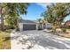 Beautiful single-story home with large driveway, lush landscaping and a well-maintained lawn at 4473 Diamond S Cir, Sarasota, FL 34233