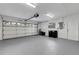 Spacious garage with epoxy flooring, overhead door, and plenty of room for storage at 4473 Diamond S Cir, Sarasota, FL 34233
