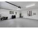 Large garage showing water heater, storage and side door to exterior of home at 4473 Diamond S Cir, Sarasota, FL 34233