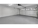 Clean, spacious garage with white walls and a sealed floor that reflects light at 4473 Diamond S Cir, Sarasota, FL 34233