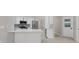 Bright kitchen with white cabinets, stainless steel appliances, and island at 4473 Diamond S Cir, Sarasota, FL 34233