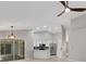 Bright kitchen features white cabinets, stainless steel appliances, and a modern pendant light at 4473 Diamond S Cir, Sarasota, FL 34233