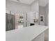 Bright kitchen with white cabinets, stainless steel appliances, and island at 4473 Diamond S Cir, Sarasota, FL 34233