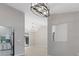 Open concept living room with modern lighting fixtures and spacious area for entertaining at 4473 Diamond S Cir, Sarasota, FL 34233