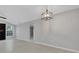 Open-concept living room with modern lighting at 4473 Diamond S Cir, Sarasota, FL 34233