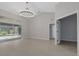 An open living area is shown with access to the exterior and bedrooms, providing an abundance of space at 4473 Diamond S Cir, Sarasota, FL 34233