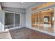 Brick patio offers an outdoor seating area with views into the home's interior at 4473 Diamond S Cir, Sarasota, FL 34233