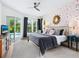 Spacious bedroom with backyard view, modern decor, and comfortable furnishings at 4492 Del Sol Blvd, Sarasota, FL 34243