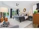 Light and airy bedroom with pool view, stylish decor, and comfortable furnishings at 4492 Del Sol Blvd, Sarasota, FL 34243