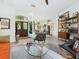 Inviting entryway with double wooden doors, modern decor, and open floor plan at 4492 Del Sol Blvd, Sarasota, FL 34243