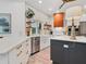 Spacious kitchen with quartz countertops, stainless appliances, and custom cabinetry at 4492 Del Sol Blvd, Sarasota, FL 34243