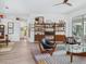 Open-concept living room featuring modern decor, sleek furniture, and light wood floors at 4492 Del Sol Blvd, Sarasota, FL 34243