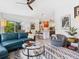 Open-concept living area with view of the kitchen, modern furniture, and abundant natural light at 4492 Del Sol Blvd, Sarasota, FL 34243