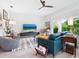 Stylish living room with large windows, modern decor, and a comfortable seating arrangement at 4492 Del Sol Blvd, Sarasota, FL 34243