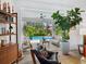Inviting living room with hardwood floors, modern furniture, and a seamless view of the outdoor pool, perfect for relaxation at 4492 Del Sol Blvd, Sarasota, FL 34243