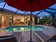 Stunning pool view showcases the screened enclosure, seamlessly blending indoor and outdoor living with ample seating at 4492 Del Sol Blvd, Sarasota, FL 34243