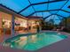 Inviting pool area with a screened enclosure, comfortable lounge chairs, and seamless connection to indoor living spaces at 4492 Del Sol Blvd, Sarasota, FL 34243