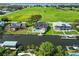 Aerial view of the property highlighting its canal-front location, boat lift, pool, and spacious backyard at 4506 17Th W St, Palmetto, FL 34221