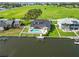 Aerial view of a waterfront property with a pool, patio, and private dock at 4506 17Th W St, Palmetto, FL 34221
