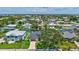 Aerial view of waterfront community with canals, homes, and tropical landscaping at 4506 17Th W St, Palmetto, FL 34221