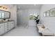 Beautiful bathroom with marble floors, a glass shower, and a sleek vanity at 4506 17Th W St, Palmetto, FL 34221