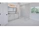 Bathroom featuring a double sink vanity, a clear glass shower and marble-like floor tiles at 4506 17Th W St, Palmetto, FL 34221