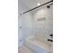 A bathtub is surrounded by large subway tile and black hardware at 4506 17Th W St, Palmetto, FL 34221