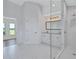 Bright bathroom with a double sink vanity, large shower and marble-like flooring at 4506 17Th W St, Palmetto, FL 34221