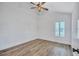 This bedroom boasts modern wainscoting, wood flooring, and neutral walls at 4506 17Th W St, Palmetto, FL 34221