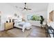 Bright bedroom with a ceiling fan, stylish decor, and a large window for natural light at 4506 17Th W St, Palmetto, FL 34221