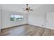 Bright bedroom with a ceiling fan and a large window with views to the outside at 4506 17Th W St, Palmetto, FL 34221