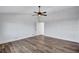 Bright bedroom featuring a ceiling fan, hard wood floors and large windows at 4506 17Th W St, Palmetto, FL 34221