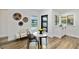 An airy dining area features a marble table and view of the outdoor pool at 4506 17Th W St, Palmetto, FL 34221