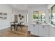 A cozy dining area offers natural light and a built-in serving area with cabinetry at 4506 17Th W St, Palmetto, FL 34221
