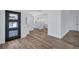 Bright entryway showcases wood floors, a modern front door, and a view into the kitchen at 4506 17Th W St, Palmetto, FL 34221
