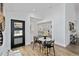 A home entryway shows a marble dining table, a decorative bench, and an open floor plan at 4506 17Th W St, Palmetto, FL 34221