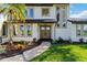 Beautifully landscaped home exterior with well-manicured lawn and charming walkway leading to a double door entry at 4506 17Th W St, Palmetto, FL 34221