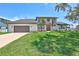 Beautiful two-story home with attached two-car garage, manicured front lawn, and freshly planted landscaping at 4506 17Th W St, Palmetto, FL 34221