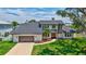 An aerial view of a beautiful two-story home with a well-manicured lawn and a two-car garage at 4506 17Th W St, Palmetto, FL 34221