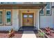 A close-up of the front door showcasing its elegant design and welcoming entrance to the home at 4506 17Th W St, Palmetto, FL 34221