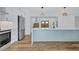 Well-designed kitchen with a center island, stainless steel appliances, and warm wood-look flooring at 4506 17Th W St, Palmetto, FL 34221