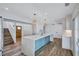 A modern kitchen featuring a large island with pendant lights, light countertops, and stainless steel appliances at 4506 17Th W St, Palmetto, FL 34221