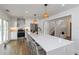 Bright kitchen with white countertops and cabinets, stainless steel appliances, and pendant lighting over an island at 4506 17Th W St, Palmetto, FL 34221