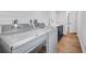 Bright laundry area with new washer and dryer, shaker cabinets, and shiplap walls at 4506 17Th W St, Palmetto, FL 34221