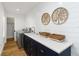 Well-appointed laundry room with modern appliances, sink, and stylish decor at 4506 17Th W St, Palmetto, FL 34221